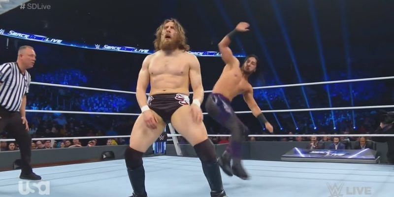 Mustafa Ali prepares to superkick an unwary Daniel Bryan.